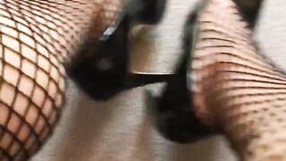 fishnets & high-heeled slippers close-up